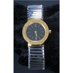 Bulgari, a lady's 18ct gold and steel round bracelet watch, circa 1990, ref.BB23 2T P109 464, the...