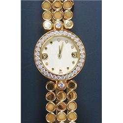 Harry Winston, a lady's 18ct gold bracelet watch, the ivory dial with dot numerals and baton hand...