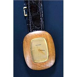 Boucheron, an 18ct gold and wood oblong designer wristwatch, circa 1970, No.19292, the gold dial...