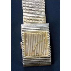 Boucheron, a lady's 18ct gold bracelet watch, ref.BT 908-247, the reeded gold dial with raised go...