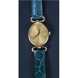 Ebel, a lady's 18ct gold oval wristwatch, circa 1970, ref.878236, the brushed gold dial with daup...