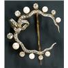Image 1 : A late Victorian diamond and pearl brooch in the form of a ribbon-tied wavy closed crescent of ro...