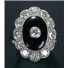 Image 1 : An early 20th century black onyx and diamond oval cluster ring, the central oval black onyx panel...