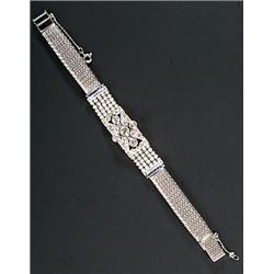 An Art Deco sapphire, diamond and seed pearl bracelet, with a central old-cut and early round bri...