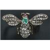 Image 1 : A late Victorian 'Bee' brooch, with pave set rose diamond wings and thorax, emerald body and a ru...