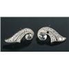 Image 1 : A pair of diamond scroll ear studs, each set with a large rose diamond approx. 6.7mm diameter, an...