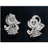 Image 1 : A pair of diamond clips circa 1950, in the form of scrolls and ribbons set with round brilliant,...