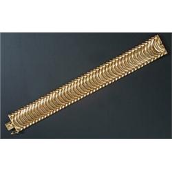 An 18ct gold broad bracelet in the form of articulated arches, London 2002, 47.8g...