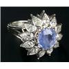 Image 1 : A sapphire and diamond flower-head cluster ring, centred with a cushion-shaped native-cut sapphir...