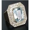 Image 1 : An aquamarine and diamond cluster ring, centred with a cut-corner rectangular scissors-cut aquama...