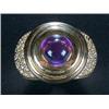 Image 1 : A modern amethyst and diamond dress ring, centred with a round cabochon amethyst to a tiered surr...