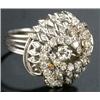 Image 1 : A diamond cluster ring of swirling bombe form, centred with a round brilliant approx. 0.19cts, wi...