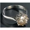 Image 1 : A diamond solitaire ring, the tinted round brilliant approx. 2.20cts, claw set in white, stamped...