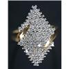 Image 1 : An 18ct gold and diamond cluster ring of 'slashed' marquise outline set with small round brillian...