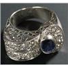Image 1 : A sapphire and diamond dress ring, centred with an oval mixed-cut sapphire flanked by an old-cut...