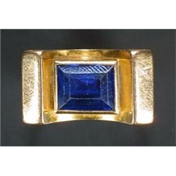 A Continental yellow metal and dark blue synthetic spinel ring in cocktail style...