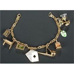 A modern Italian anchor link 'charm' bracelet emblematic of the vices, with eight pendent charms,...