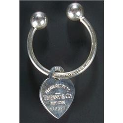A Tiffany & Co silver key ring of torque form with a heart-shaped and engraved fob pendant, no.51...