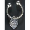 Image 1 : A Tiffany & Co silver key ring of torque form with a heart-shaped and engraved fob pendant, no.51...