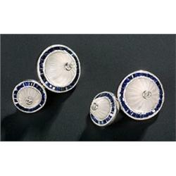 A pair of sapphire, rock crystal and diamond cufflinks, each link of two graduated round panels e...