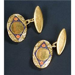 A pair of floral enamelled oval cufflinks, each textured oval link with a central raised diamond-...