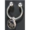 Image 1 : A Tiffany & Co silver key ring of torque form with a round engraved fob pendant, no.007185, Londo...