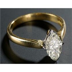 A modern 18ct gold and marquise diamond solitaire ring, the brilliant-cut stone approx. 0.55cts,...