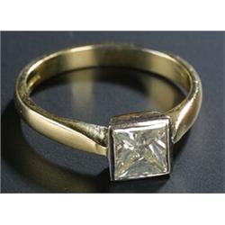 A modern 18ct gold and square diamond solitaire ring, the tinted yellow princess-cut stone approx...