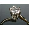 Image 1 : A diamond solitaire ring, the round brilliant approx. 0.76cts, claw set in white between cross-ov...