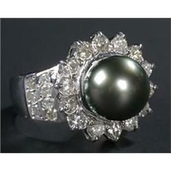 A South Sea black cultured pearl and diamond cluster ring, centred with a round bead approx.10.4m...
