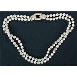 A Cartier French 18ct gold, cultured pearl and diamond necklace, the two rows of uniform cultured...