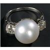 Image 1 : A South Sea cultured pearl and diamond three stone ring, the round bead approx. 12mm diameter bet...