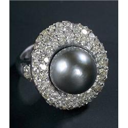 A black Tahitian cultured pearl and diamond oval cluster ring, centred with a round bead approx.1...