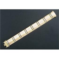 A modern Italian 18ct tri-colour gold broad bracelet, designed alternate satinised and coloured a...