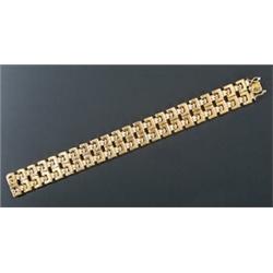 A modern Italian 18ct gold bracelet, in the form of two rows of articulated geometric and fluted...