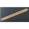 Image 1 : A modern Italian 18ct gold bracelet, in the form of two rows of articulated geometric and fluted...