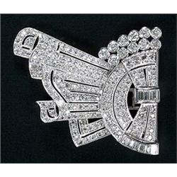 A diamond clip of open-work arched panel and linen-fold design, set throughout with early round b...