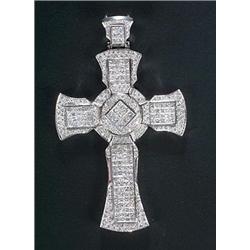 A large diamond cross of Latin design with a shaped outline, calibre set in white with princess-c...