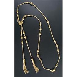 A modern 18ct gold tassel necklace, designed as satinised oval and round beads with rope-work int...