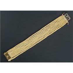 A modern multi-strand bracelet in the form of eight rows of square foxtail linkage, stamped '750'...