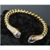 Image 1 : An iolite and diamond torque bangle, the hollow bangle with ropework decoration and heart-shaped...