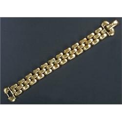 A modern Italian gold brick link bracelet, of three row design, stamped '750', 37.9g...