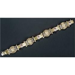 A modern bracelet in Versace style with four round panels with classical busts and Greek key bord...