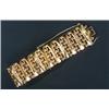 Image 1 : A modern 18ct gold broad bracelet, designed as alternate shaped-batons and beads to run across th...