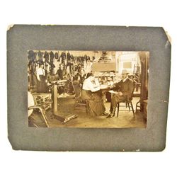 ANTIQUE MOUNTED PHOTO OF HORSE TACK STORE INTERIOR