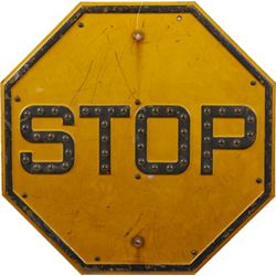 “STOP” Yellow Metal Octagon Street Sign.