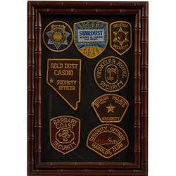 Collection Of 8 Casino Security Patches In Frame.