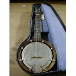 MAHOGANY CASED BANJO IN CASE. 