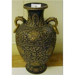 A Chinese Baluster Vase, with dragon and ring handles, decorated in gilt all over with scrolling...