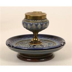 A Doulton Lambeth Stoneware Inkwell, with hinged brass lid, 11.5 cm  See illustration  £240-260...